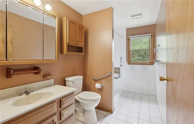 a view of a bathroom from a hallway