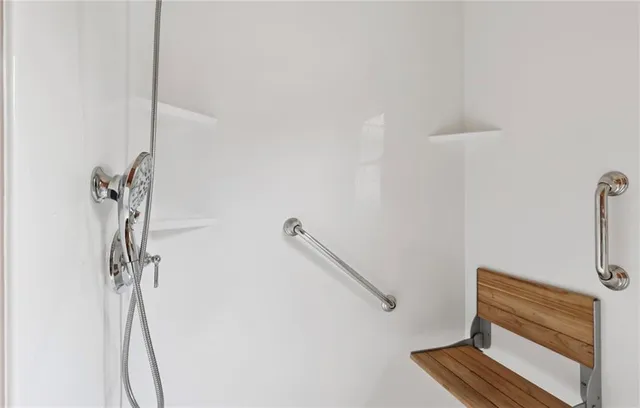 a view of storage and utility room with washer and dryer