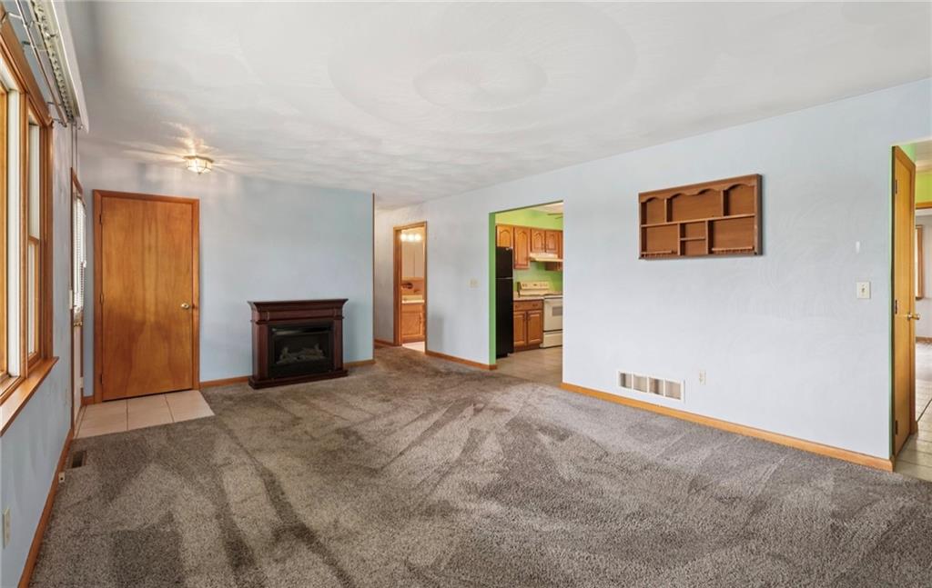 487 East Brady Road Kittanning, PA 16201 - Photo 10 of 50 a view of an empty room with window and fireplace