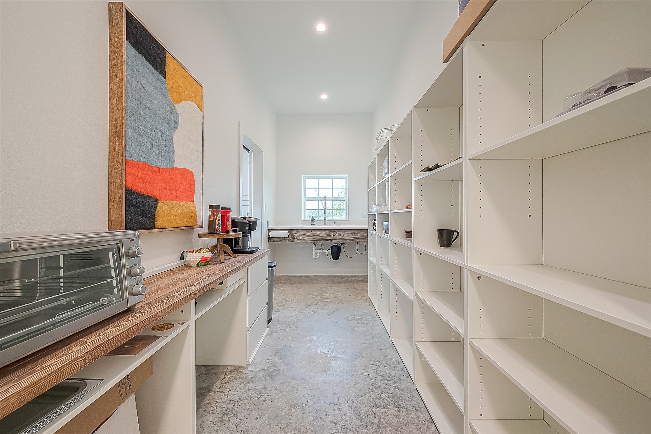 1295 Brazos River Road Freeport, TX 77541 - Photo 11 of 29 a large white kitchen with a large window