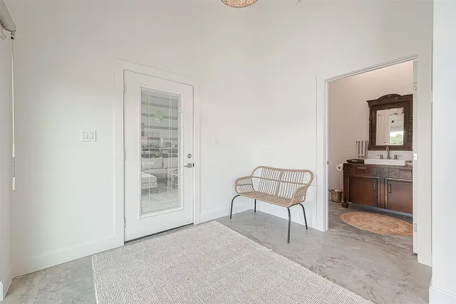 a bathroom with a toilet sink vanity and mirror