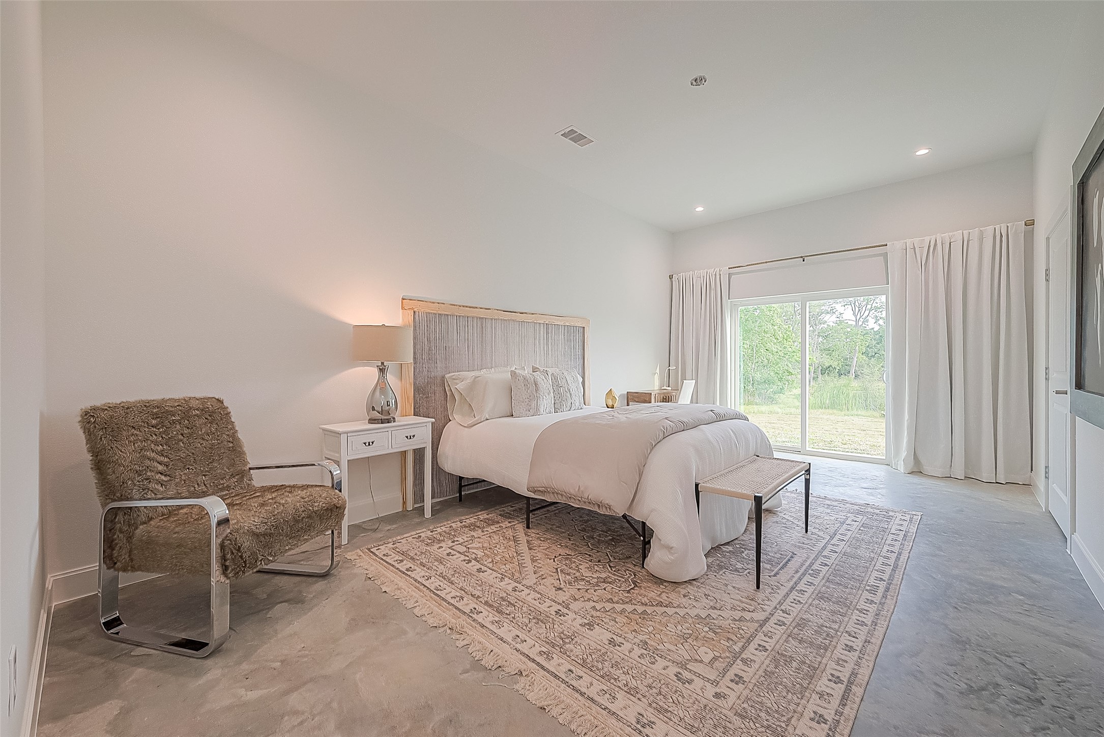 1295 Brazos River Road Freeport, TX 77541 - Photo 15 of 29 a bed room with a bed and chair