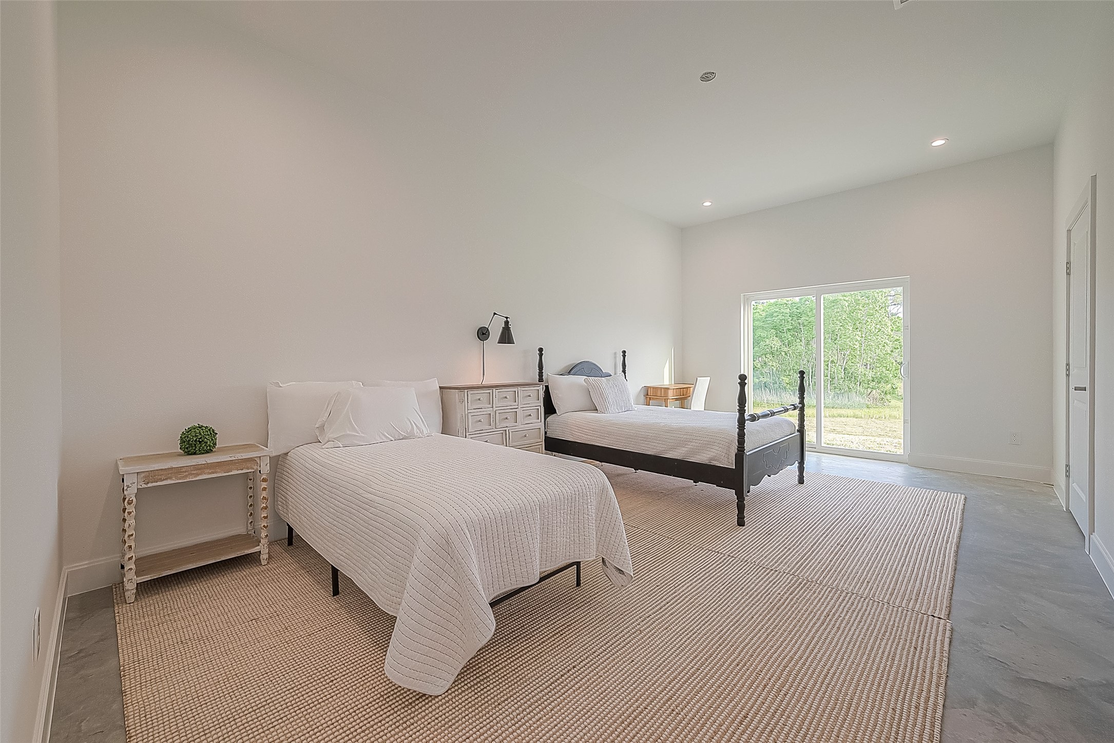 1295 Brazos River Road Freeport, TX 77541 - Photo 19 of 29 a spacious bedroom with two beds and painted walls