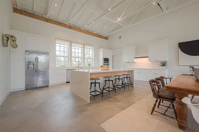 a view of a dining room with furniture window and outside view