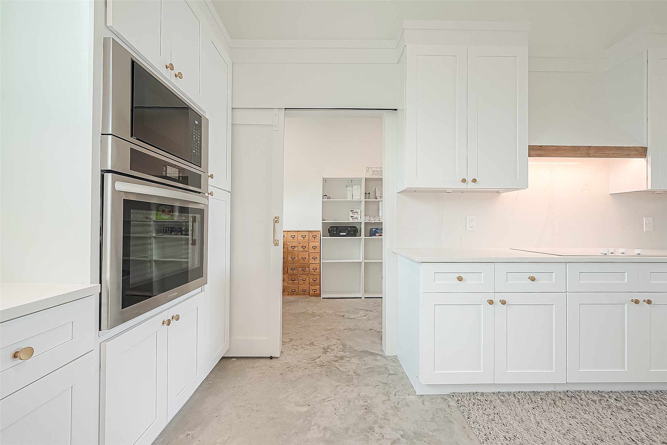 1295 Brazos River Road Freeport, TX 77541 - Photo 10 of 29 a kitchen with white cabinets and white appliances