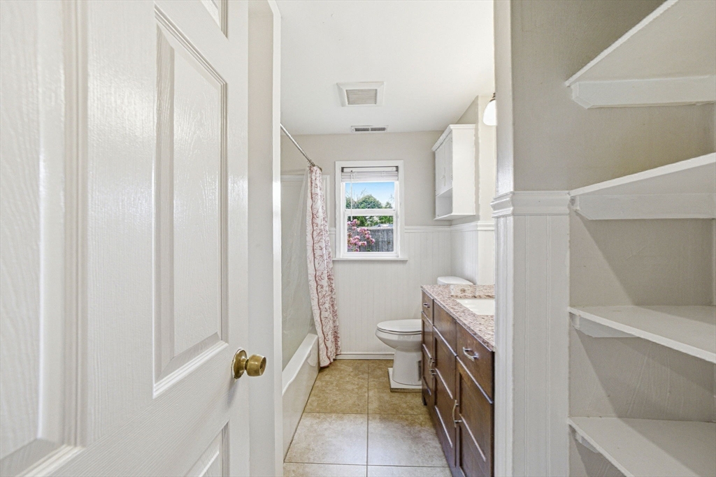157 Errol Road Brockton, MA 02302 - Photo 32 of 34 a bathroom with a sink a toilet and a shower