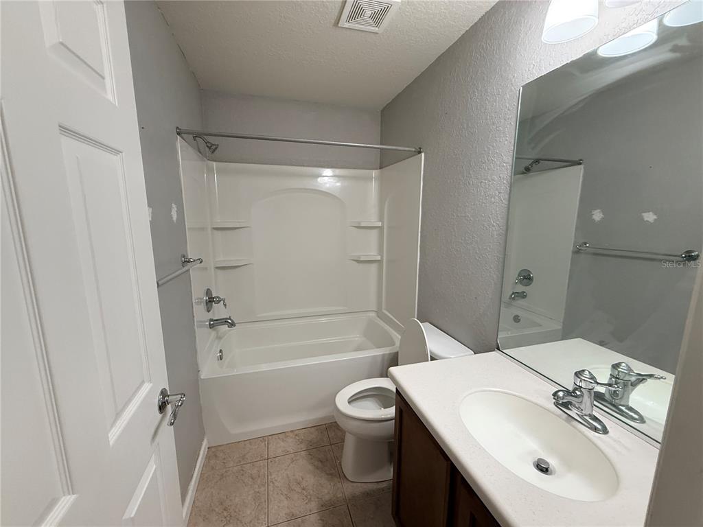 4199 Southwest 46th Court Ocala, FL 34474 - Photo 34 of 50 a bathroom with a sink toilet and shower