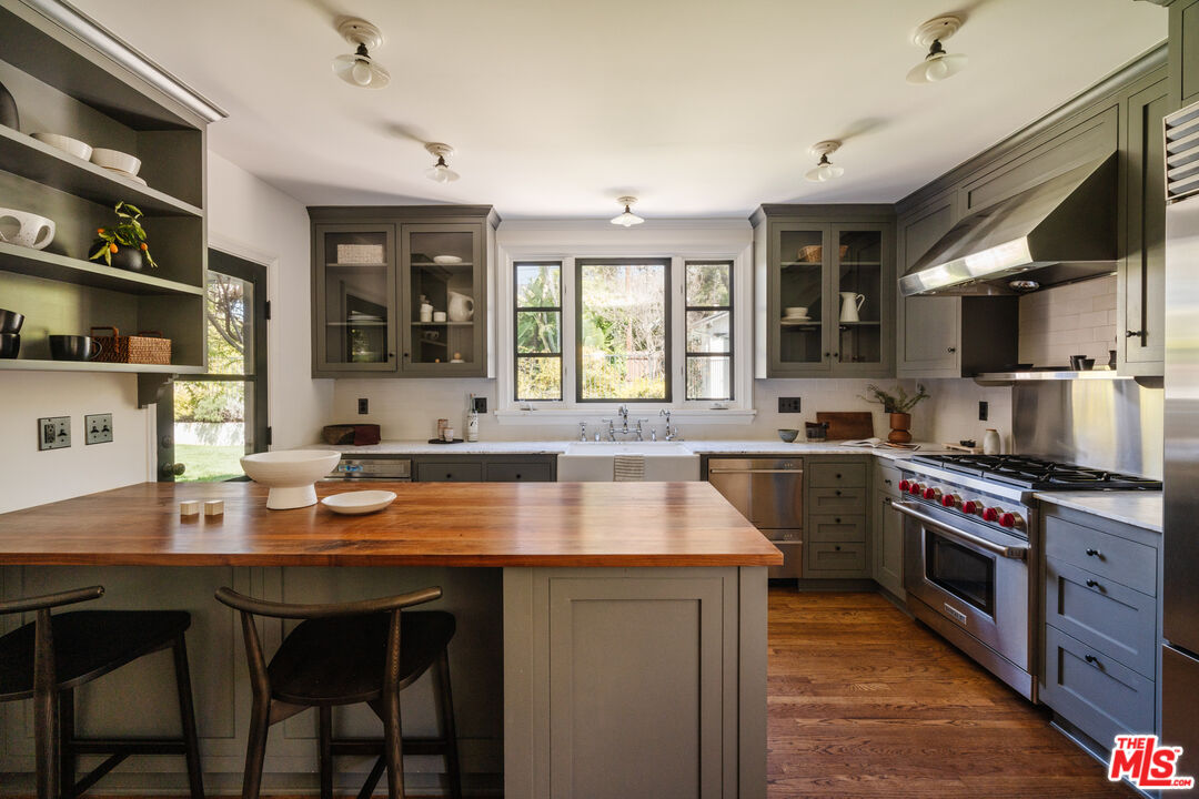1175 Sonoma Drive Altadena, CA 91001 - Photo 14 of 68 a kitchen with a stove a sink and a refrigerator