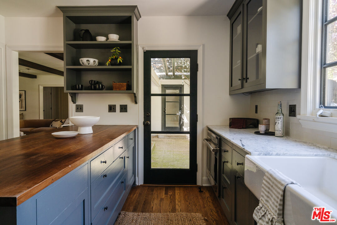 1175 Sonoma Drive Altadena, CA 91001 - Photo 16 of 68 a kitchen with stainless steel appliances granite countertop a refrigerator and a stove top oven
