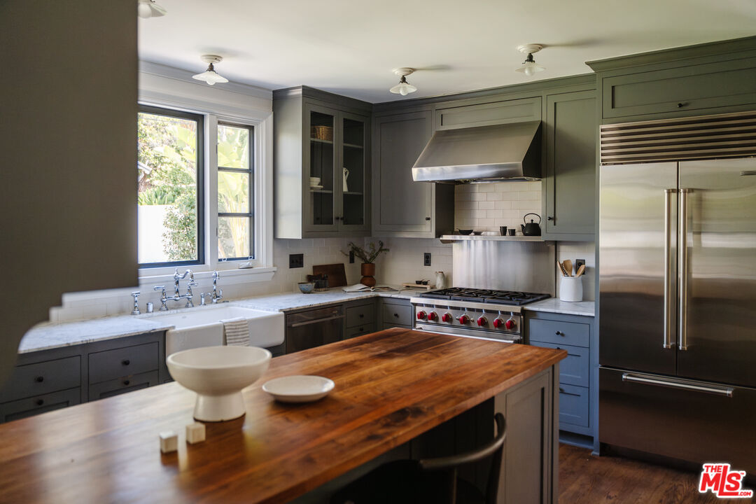 1175 Sonoma Drive Altadena, CA 91001 - Photo 17 of 68 a kitchen with a stove a sink and a refrigerator