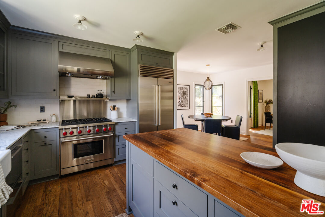 1175 Sonoma Drive Altadena, CA 91001 - Photo 18 of 68 a kitchen with sink stove and wooden floor