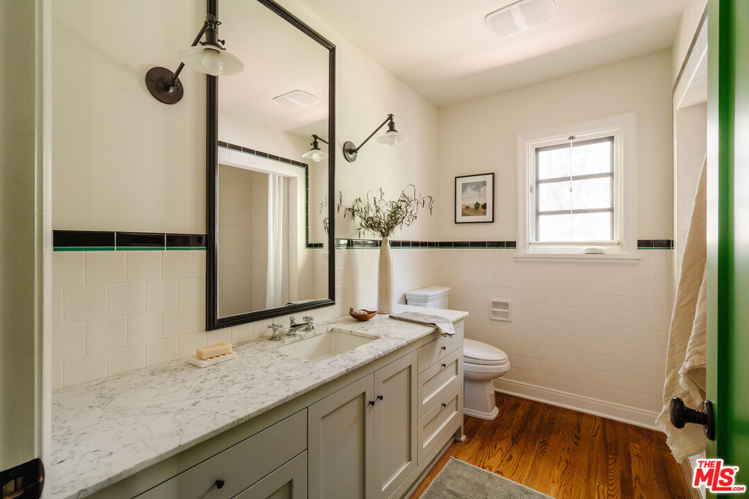 1175 Sonoma Drive Altadena, CA 91001 - Photo 24 of 68 a bathroom with a granite countertop sink toilet and shower