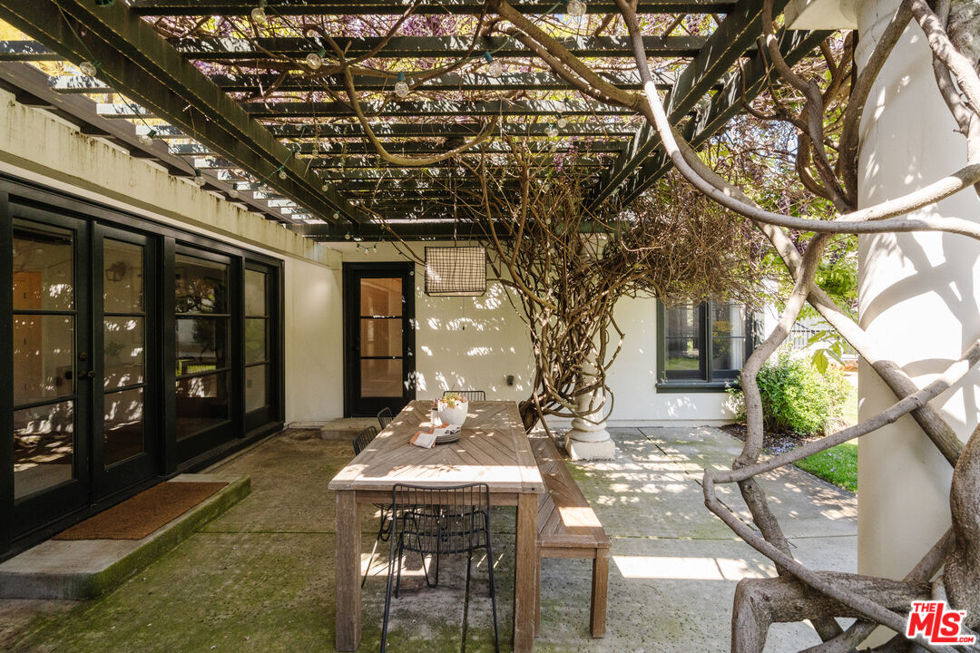1175 Sonoma Drive Altadena, CA 91001 - Photo 39 of 68 a view of a patio with table and chairs and potted plants