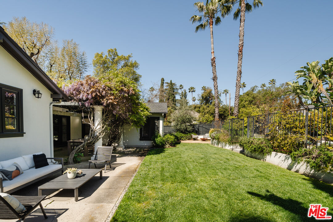 1175 Sonoma Drive Altadena, CA 91001 - Photo 40 of 68 a view of a backyard with plants and a fountain