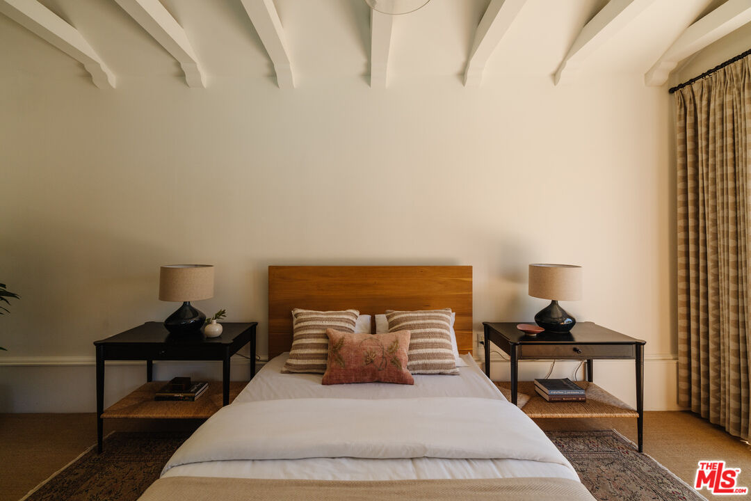 1175 Sonoma Drive Altadena, CA 91001 - Photo 44 of 68 a bedroom with a bed and a lamp on table