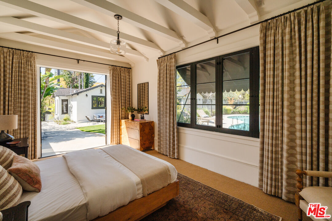 1175 Sonoma Drive Altadena, CA 91001 - Photo 46 of 68 a bedroom with a large bed and a large window