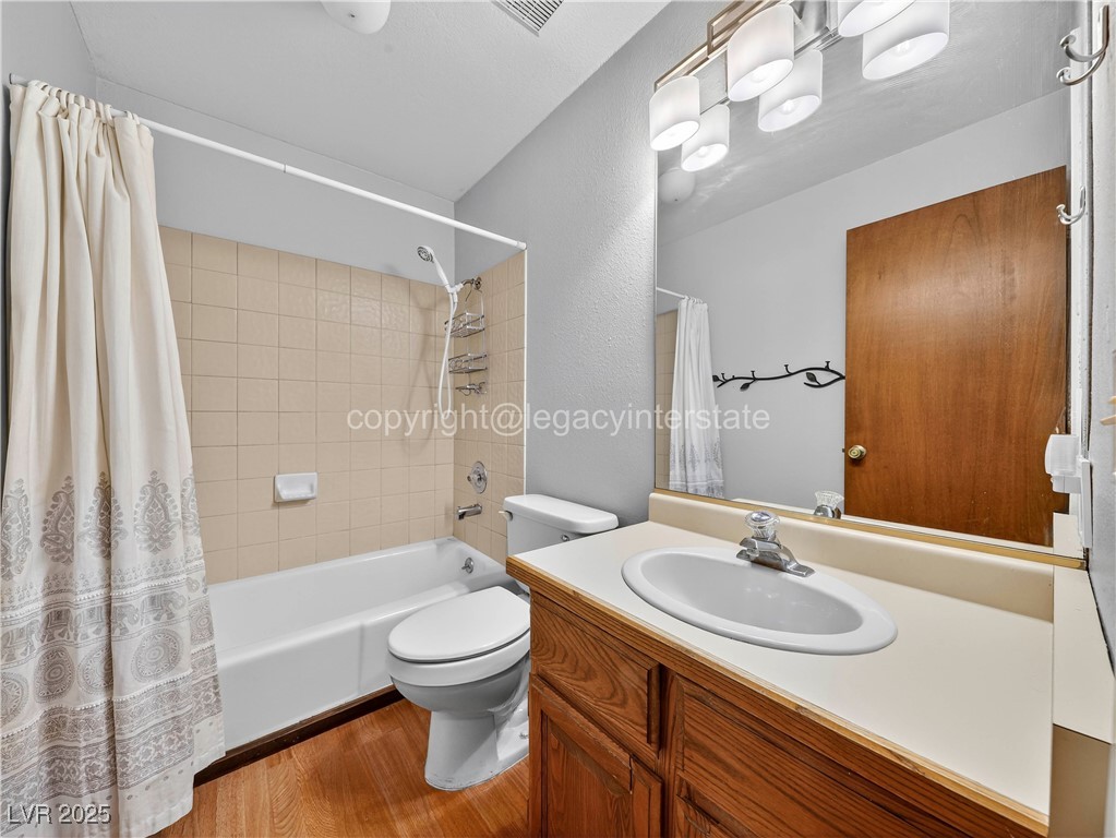 390 East 300 South, Unit 3A Parowan, UT 84761 - Photo 16 of 25 Full bath with shower / bath combination with curtain, light wood-style flooring, vanity, and a textured wall