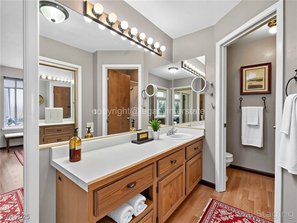 390 East 300 South, Unit 3A Parowan, UT 84761 - Photo 21 of 25 Bathroom featuring light wood-type flooring and vanity-virtual staging