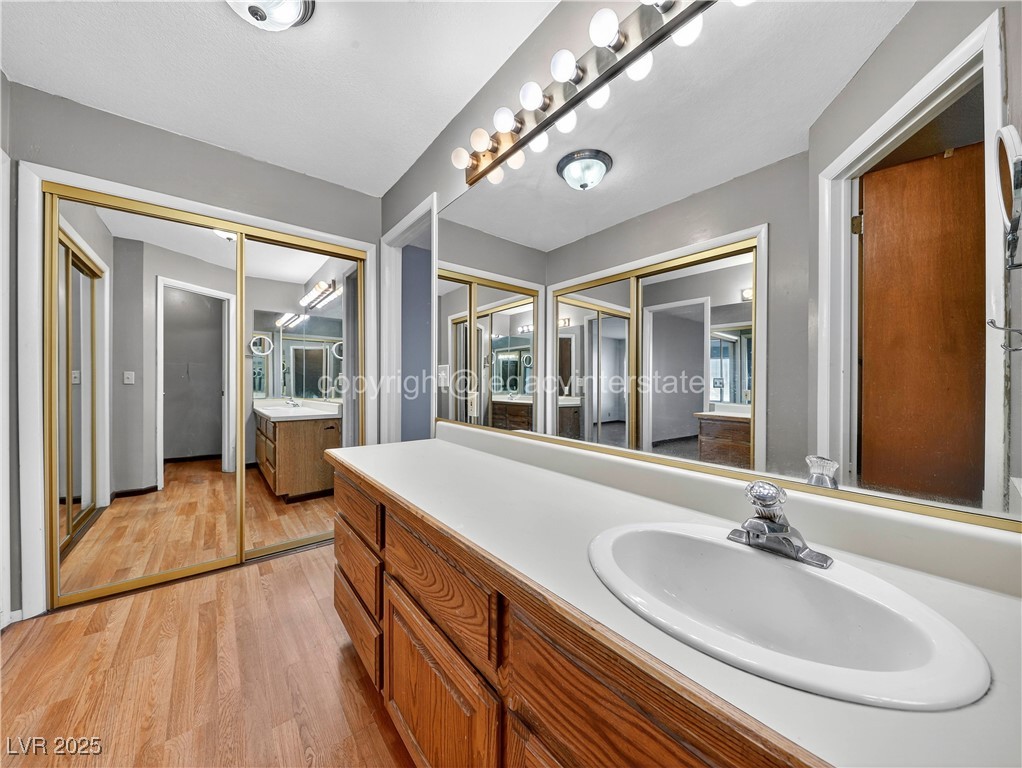 390 East 300 South, Unit 3A Parowan, UT 84761 - Photo 22 of 25 Full bathroom featuring light wood-style floors and vanity