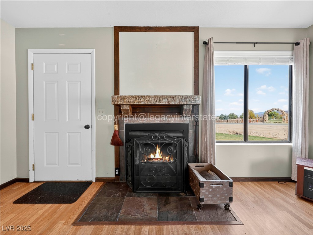 390 East 300 South, Unit 3A Parowan, UT 84761 - Photo 5 of 25 Detailed view of wood finished floors and a fireplace with flush hearth