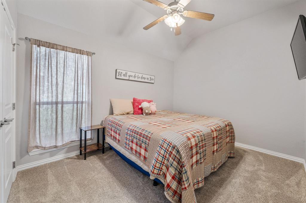 2936 Willow Ridge Circle Granbury, TX 76049 - Photo 16 of 33 a bedroom with a bed and window