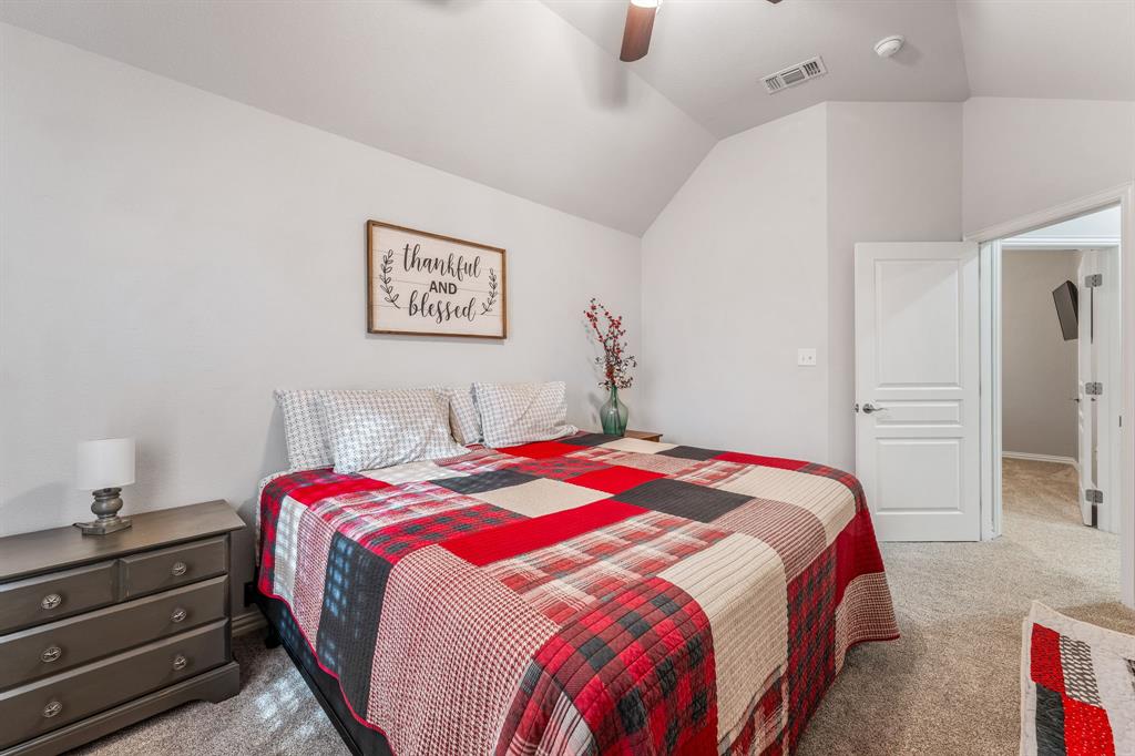 2936 Willow Ridge Circle Granbury, TX 76049 - Photo 19 of 33 a bedroom with a bed and a cabinets