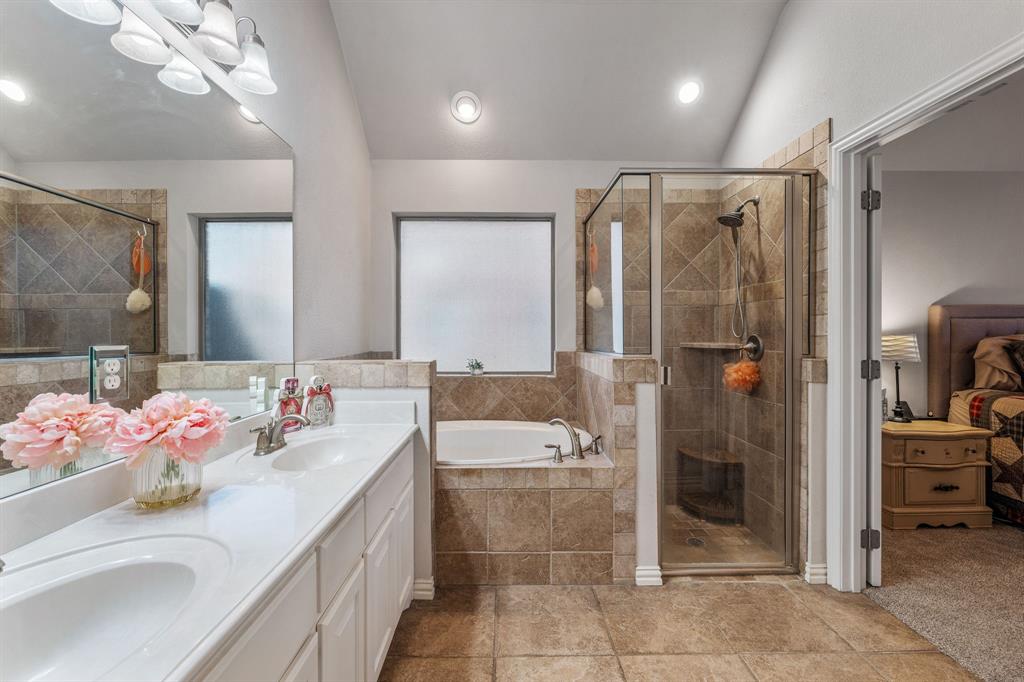 2936 Willow Ridge Circle Granbury, TX 76049 - Photo 25 of 33 a bathroom with a sink mirror and shower