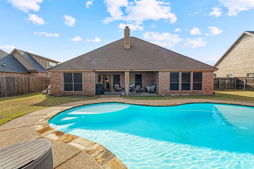 2936 Willow Ridge Circle Granbury, TX 76049 - Photo 32 of 33 a view of a house with swimming pool and porch