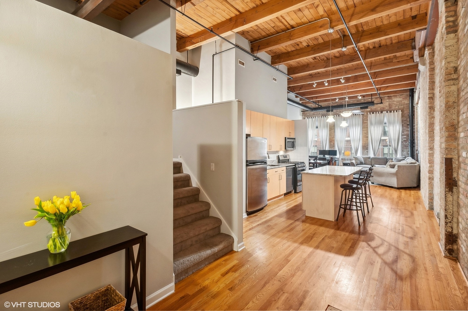 1733 West Irving Park Road, Unit 214 Chicago, IL 60613 - Photo 12 of 20 a view of kitchen with furniture and wooden floor