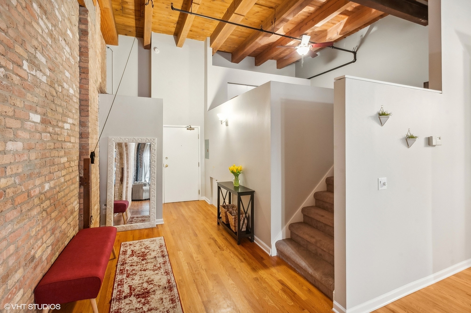 1733 West Irving Park Road, Unit 214 Chicago, IL 60613 - Photo 15 of 20 a view of hallway with stairs and wooden floor