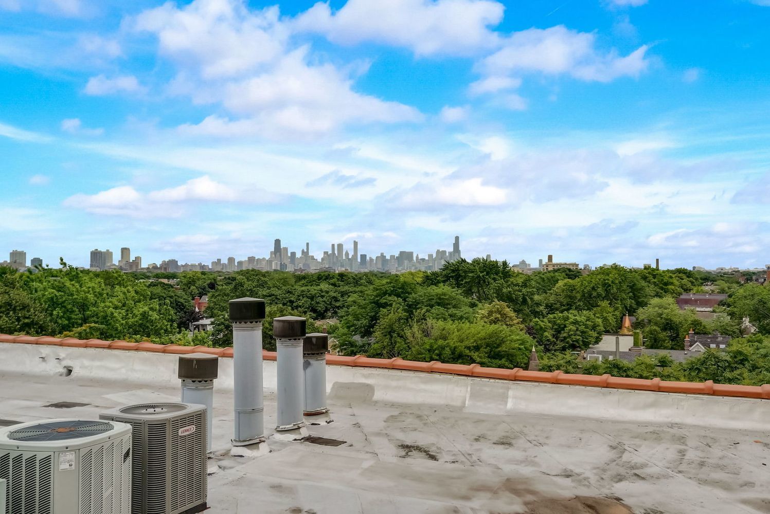 1733 West Irving Park Road, Unit 214 Chicago, IL 60613 - Photo 18 of 20 a view of a city from a terrace