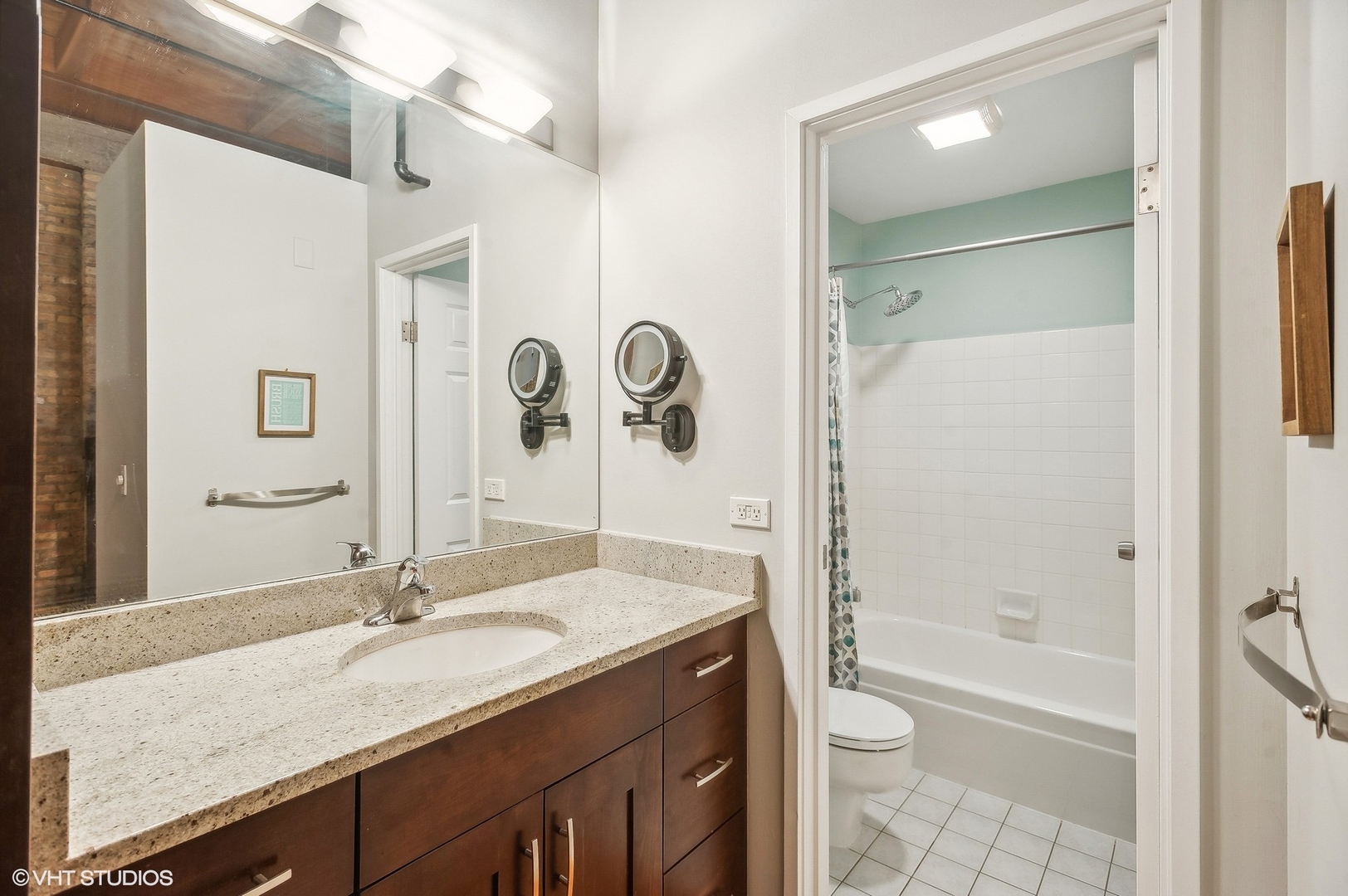 1733 West Irving Park Road, Unit 214 Chicago, IL 60613 - Photo 9 of 20 a bathroom with a granite countertop sink toilet and shower