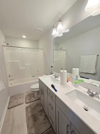 a bed room with a bed and a book shelf