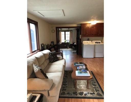 11 Monson Turnpike Road Ware, MA 01082 - Photo 16 of 28 a living room with furniture and a flat screen tv