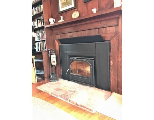 11 Monson Turnpike Road Ware, MA 01082 - Photo 21 of 28 a bedroom with a bed and a fireplace in it