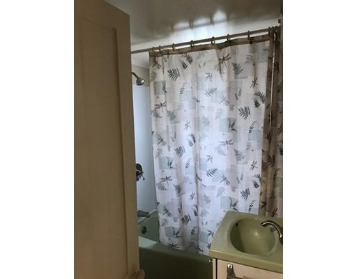 11 Monson Turnpike Road Ware, MA 01082 - Photo 22 of 28 a bathroom with a shower curtain and a sink