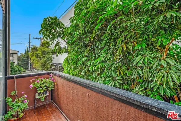 a view of a garden from a balcony