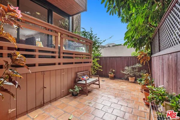 a view of a backyard with sitting area and furniture