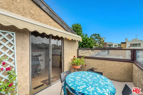 a view of balcony with a potted plant