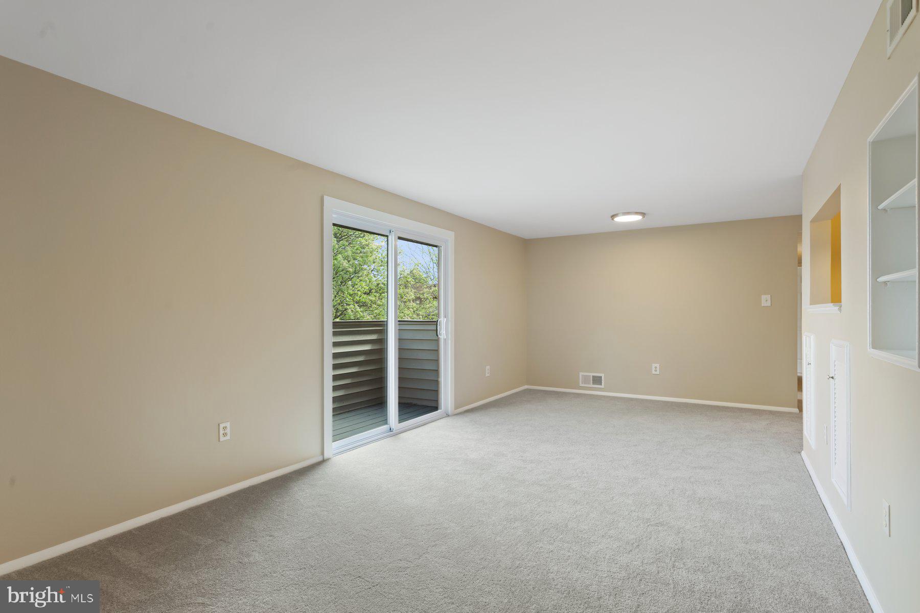 731 L Heather Ridge Drive Frederick, MD 21702 - Photo 6 of 26 Living room with built-ins. New carpet throughout.