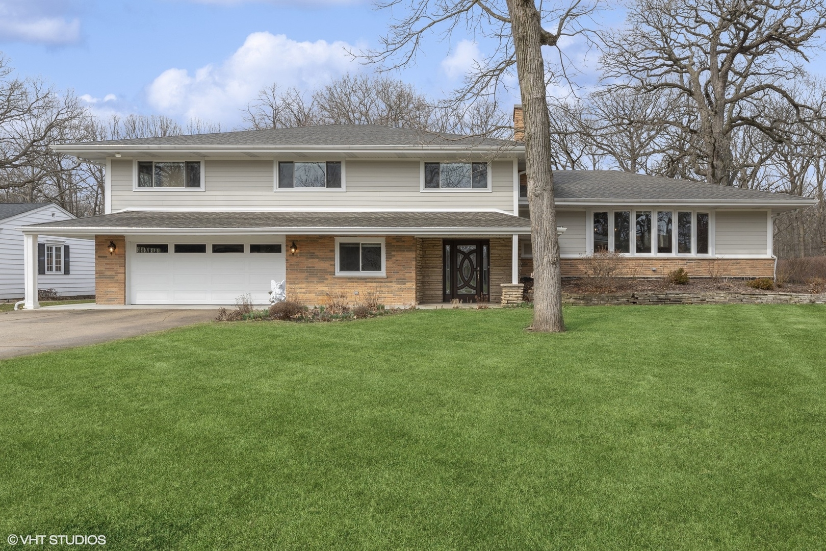 1644 Forest Drive Glenview, IL 60025 - Photo 1 of 14 a front view of house with yard and green space