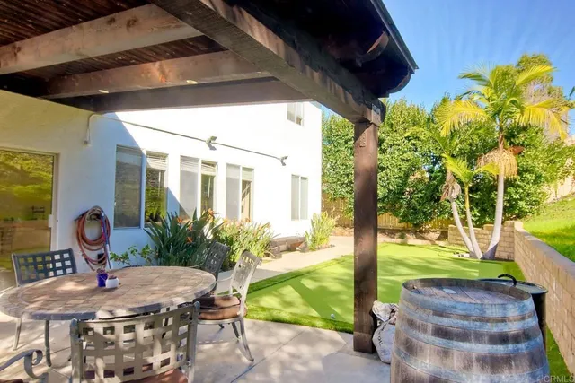 a view of a porch with furniture and yard