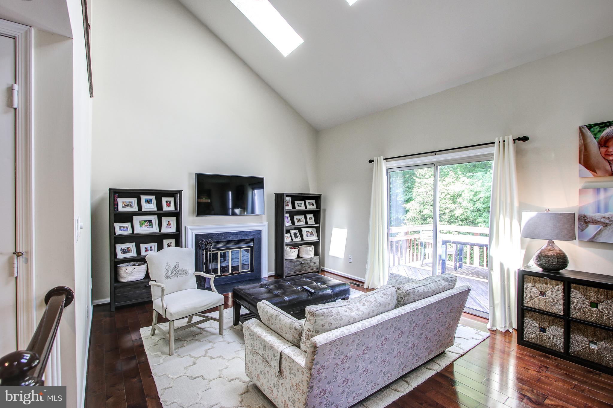 521 Ridgewell Way Silver Spring, MD 20902 - Photo 9 of 48 Family room with vaulted ceiling, fireplace.