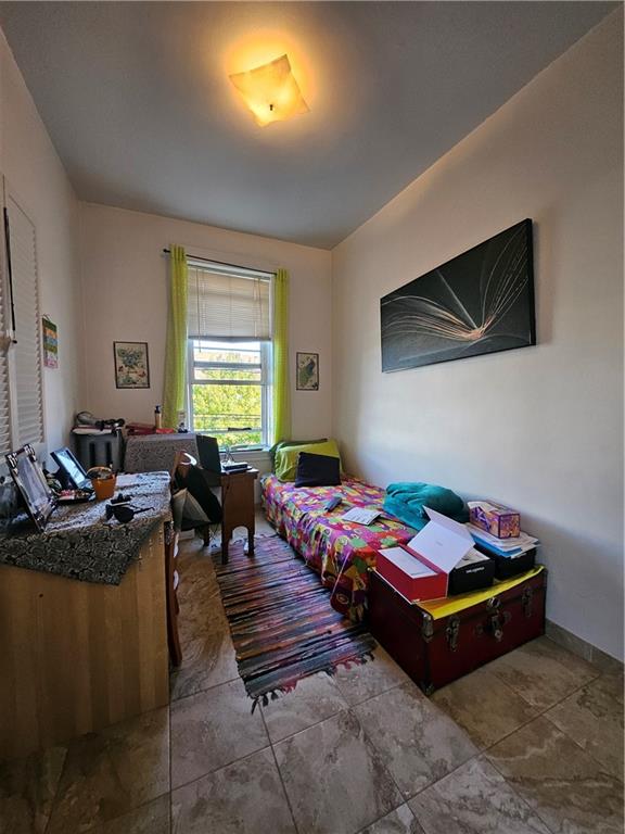 44 Quentin Road Brooklyn, NY 11223 - Photo 11 of 19 a bed room with furniture and gym equipment