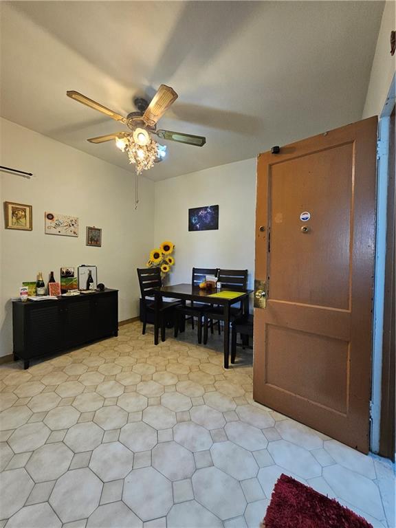 44 Quentin Road Brooklyn, NY 11223 - Photo 12 of 19 a view of workspace with wooden floor