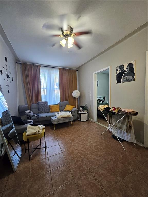 44 Quentin Road Brooklyn, NY 11223 - Photo 15 of 19 a living room with furniture and a chandelier