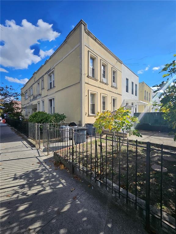 44 Quentin Road Brooklyn, NY 11223 - Photo 3 of 19 a front view of a house with a garden