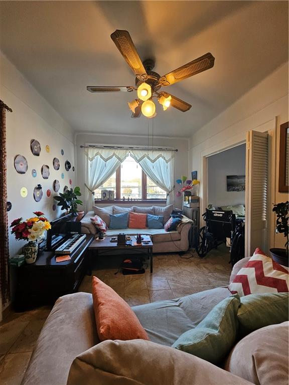 44 Quentin Road Brooklyn, NY 11223 - Photo 8 of 19 a living room with furniture fireplace and a window