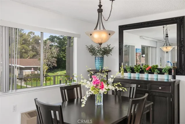 a view of a dining room with furniture window and outside view