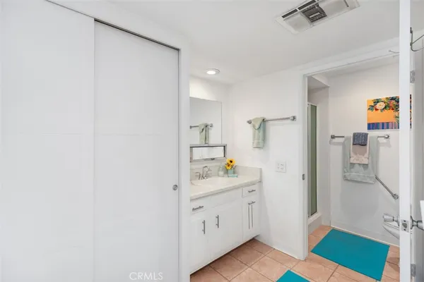 a kitchen with a sink and a refrigerator